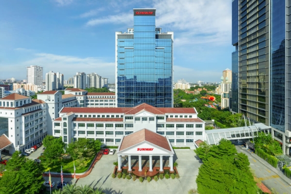 A high-angle shot of Menara Sunway featuring other buildings within Sunway City Kuala Lumpur in the background