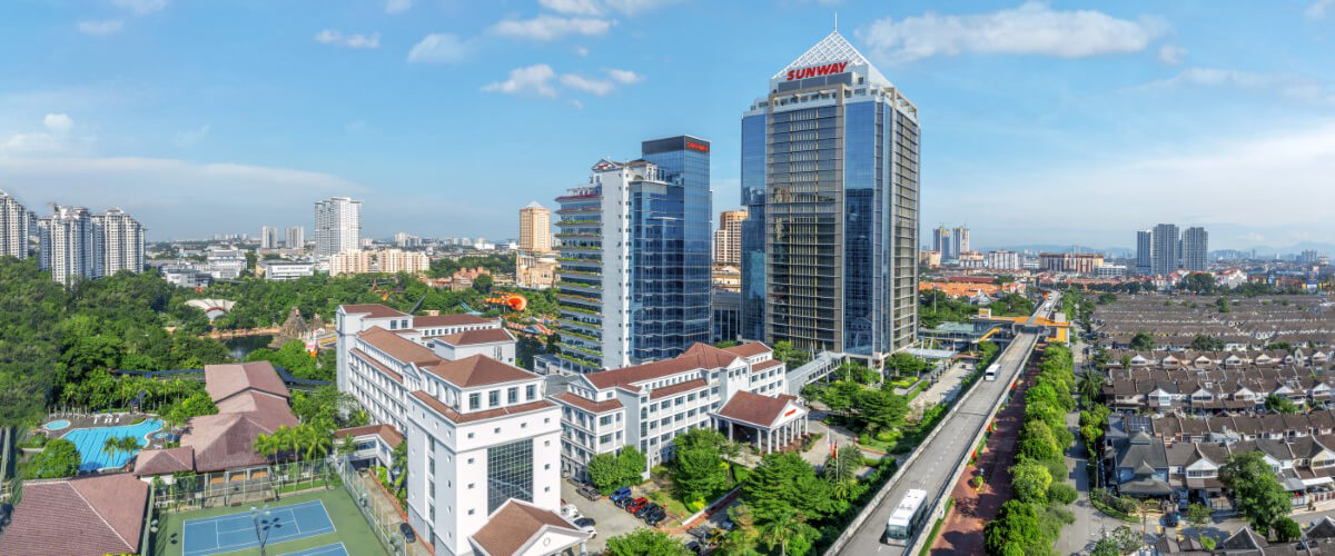 An aerial view of Menara Sunway and Sunway Pinnacle, with tennis courts besides it and the BRT lane.