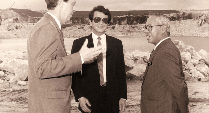 Tan Sri Sir Jeffrey Cheah alongside two other men in a black and white picture, amidst the landscape of a derelict wasteland background of Sunway City Kuala Lumpur