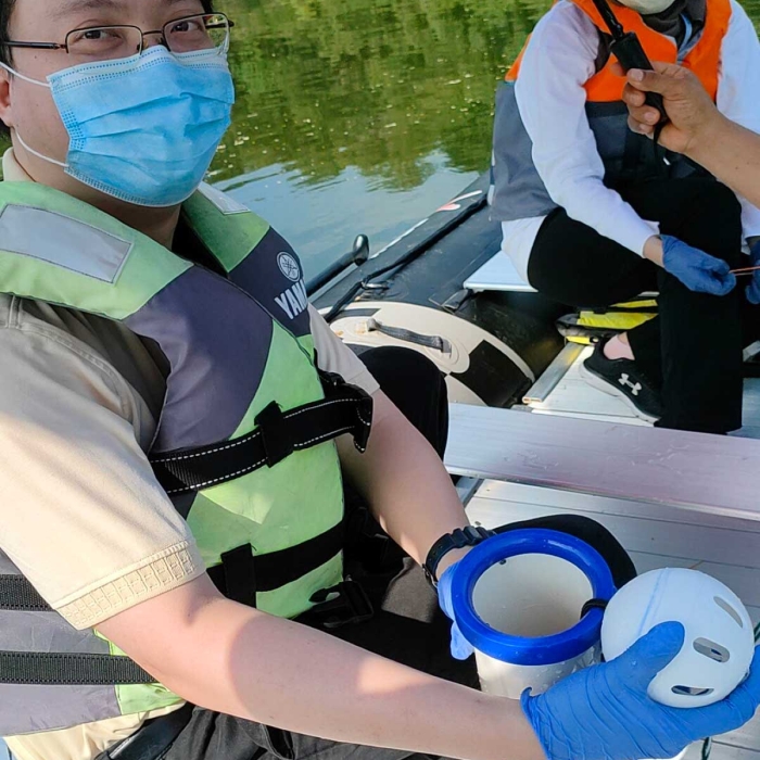 Dr. Chen and his team at Sunway South Quay lake doing water sampling for water quality research.