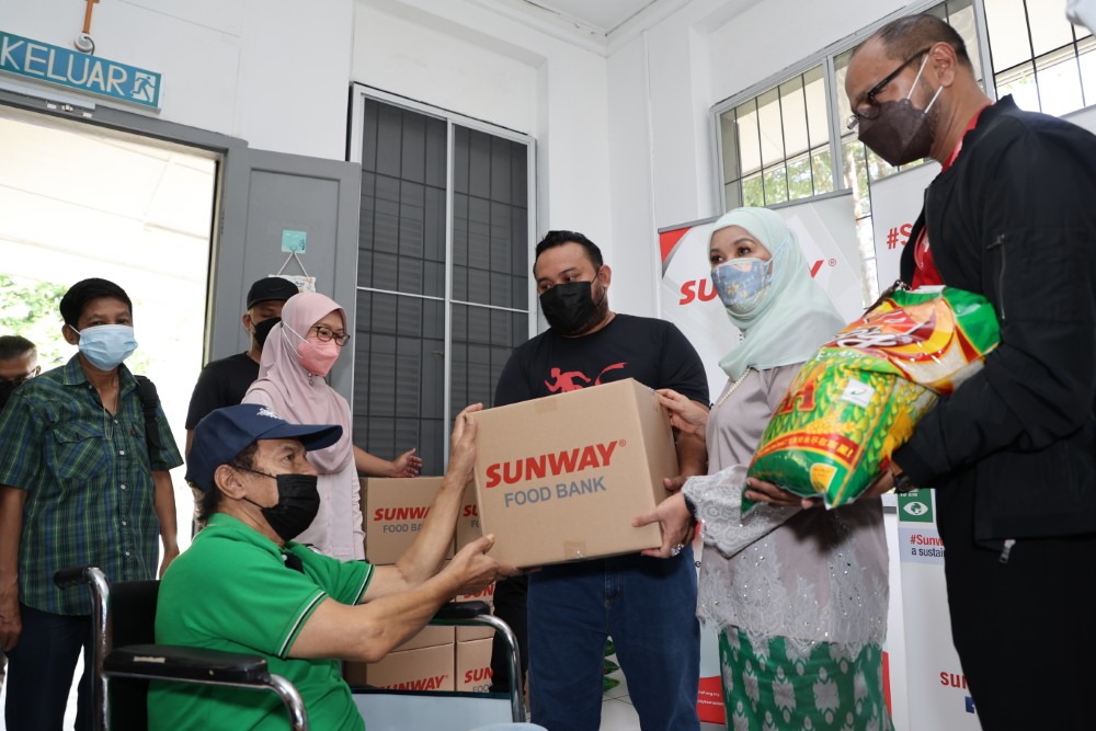 Giving out Sunway Food Bank at Teratak Kasih Tok Nan