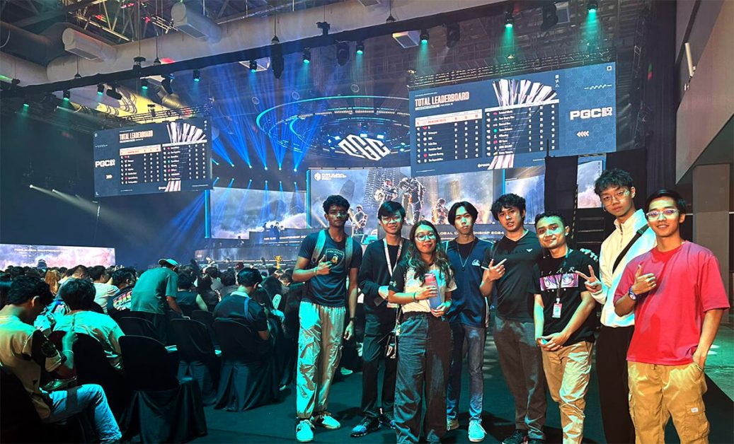 Group photo of Shamsul with fellow esports club members at a esports competition.