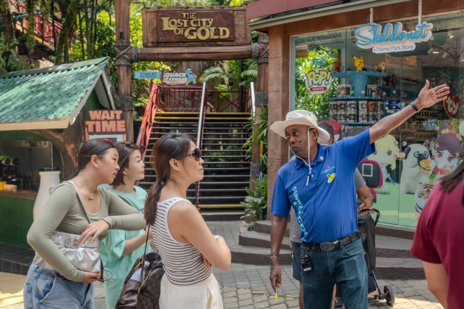 Mr. Vijayan, a Sunway Senior Park Ambassador (SPA) is helping guests at Sunway Lagoon theme park.